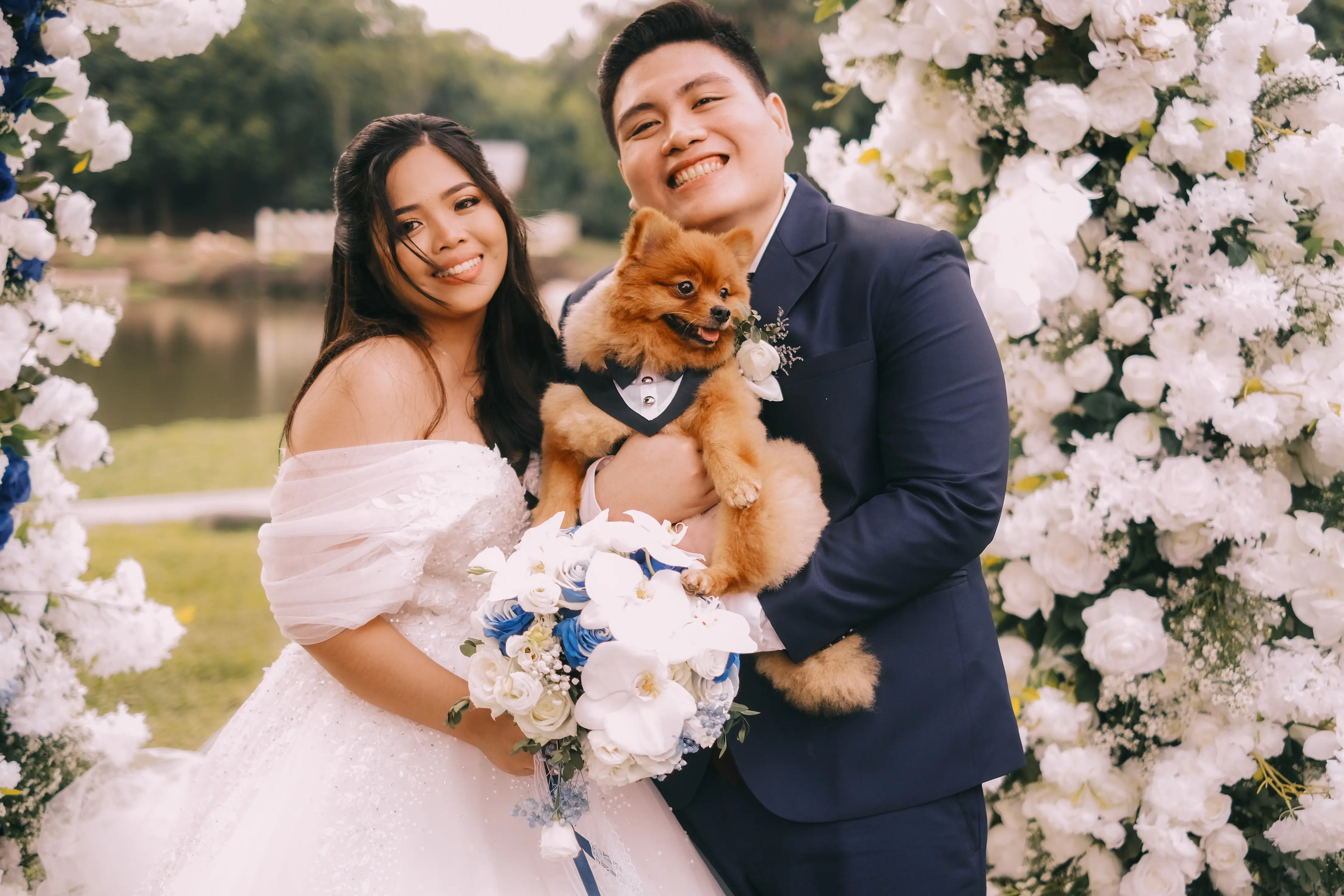 fran and luisa photo with cody in front of the ceremony arc