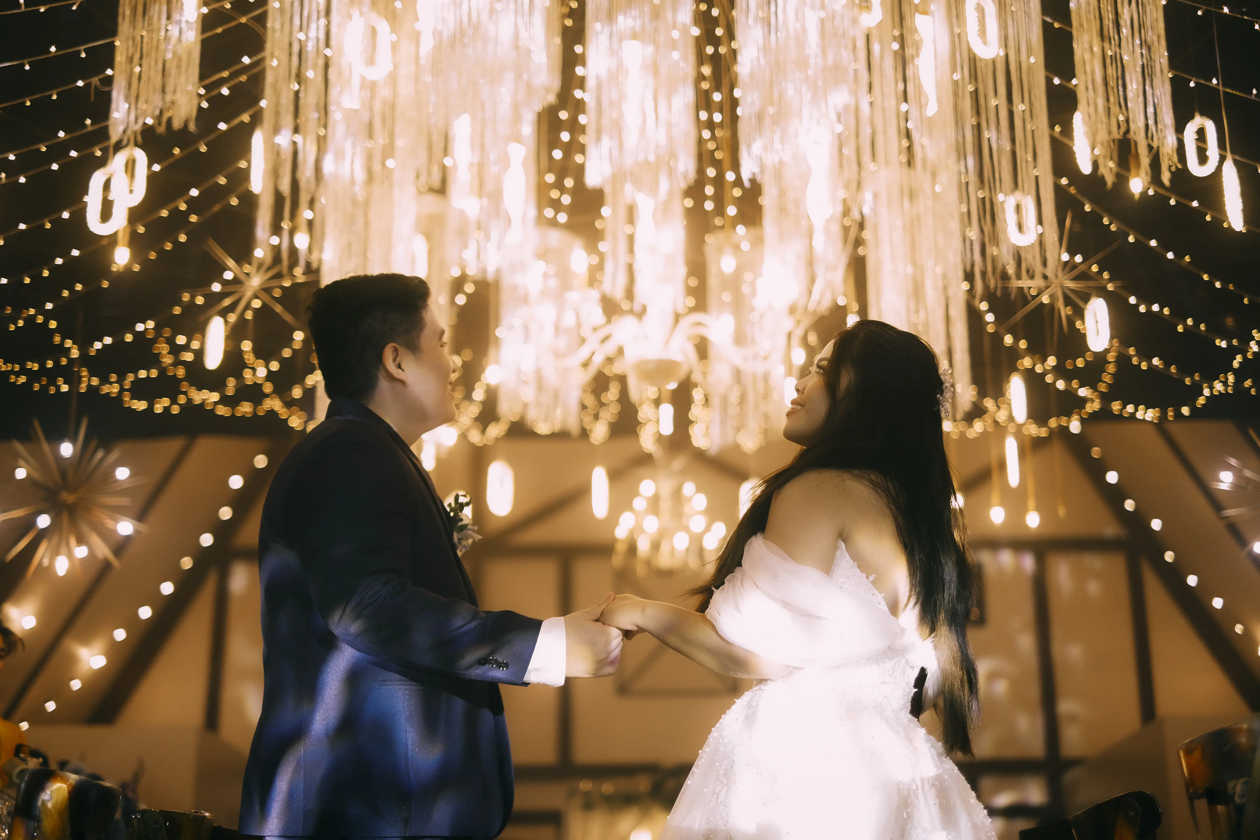 fran and luisa photo admiring the decor of the reception which has a starry night theme